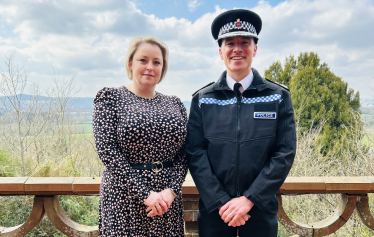Police and Crime Commissioner, Lisa Townsend, stands with Tim De Meyer, Surrey's new Chief Constable with a view of the Surrey countryside in the background